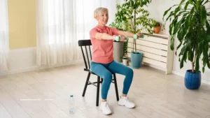 Older adult doing seated exercise class