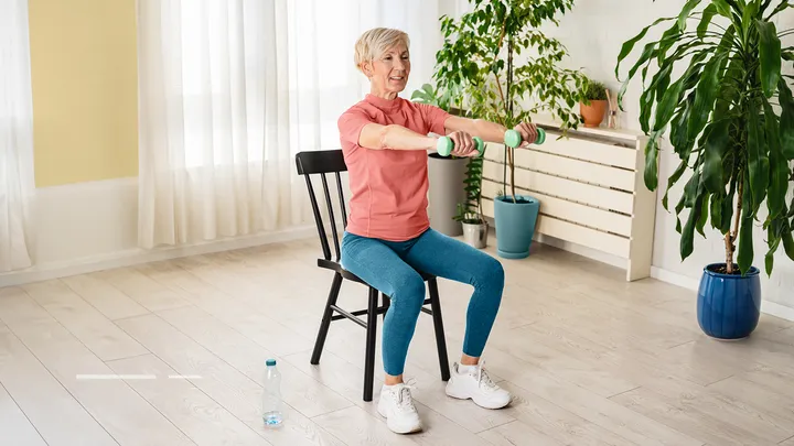 Older adult doing seated exercise class
